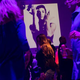 Guests dance to Prince music as a slideshow flashes images of the artist above the stage during a memorial dance party at the First Avenue nightclub in Minneapolis on April 21, 2016.
Scott Olson/Getty Images